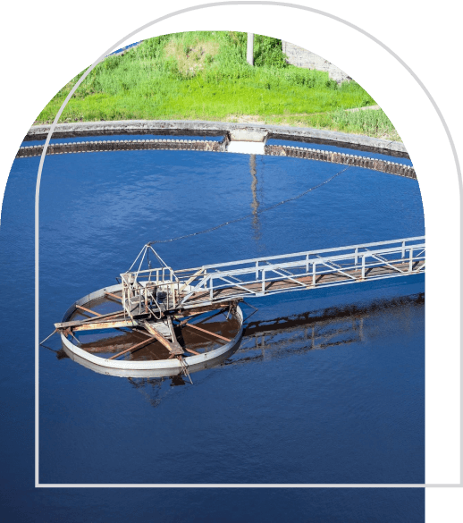 A large water plant with a wheel in the middle of it.