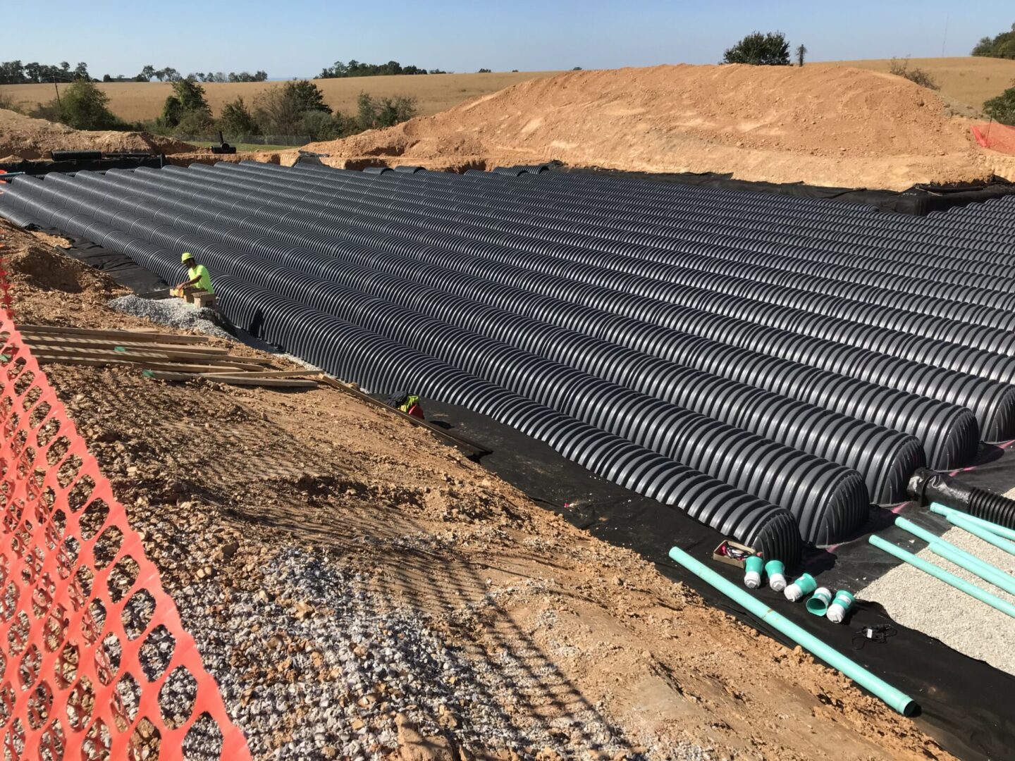 A large pipe laying on top of the ground.